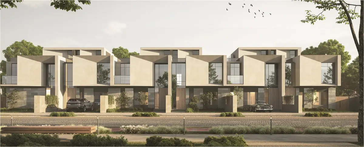 31 West – Street front of townhouses with angled light stone frames and tall glazing