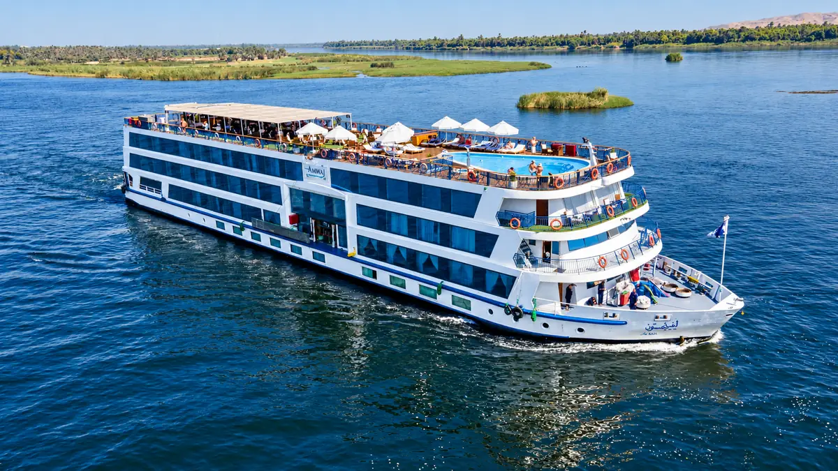 Amwaj Boat Renovation – Aerial view of the cruise boat sailing the Nile past green banks