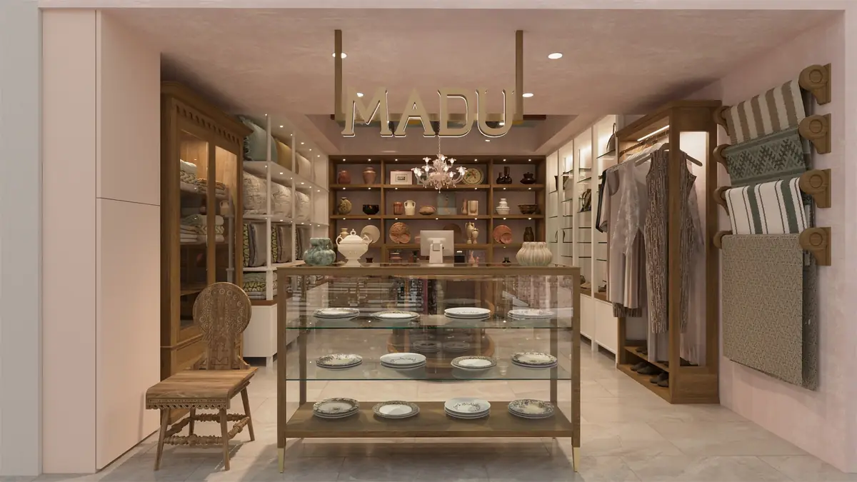 MADU Marriott Zamalek Branch – Shop front with a glass vitrine of plates, clothing rail and woven textiles