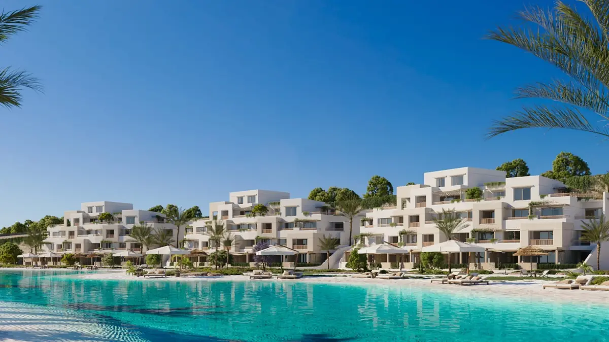 Oyster at Masyaf – Stepped white and sand-coloured terraces with parasols along the lagoon beach
